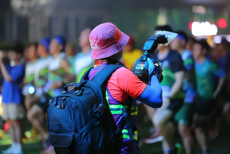 Shooting amid the runners at a night race