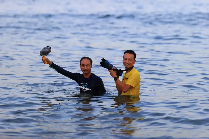 Wading into the sea for the best angle